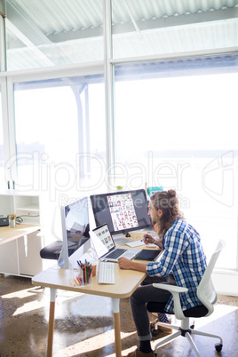 Male executive working at his desk