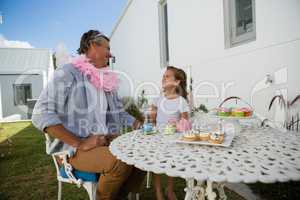 Father and daughter in fairy costume having fun