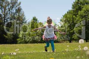 Excited girl running in park