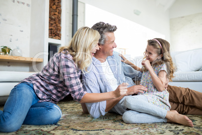 Happy family having fun in living room