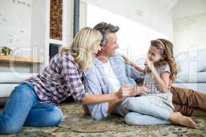 Happy family having fun in living room