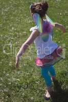 Girl playing on grass