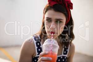 Beautiful woman drinking juice