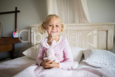 Girl relaxing on bed in the bedroom at home