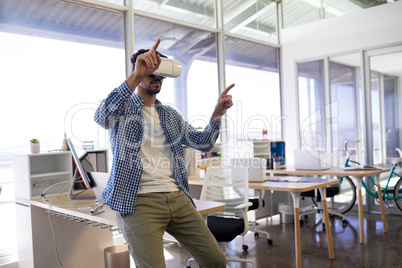 Male executive using virtual reality headset