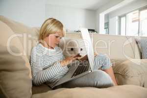 Boy using laptop in the living room