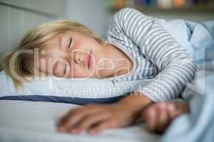 Boy sleeping on bed in the bedroom