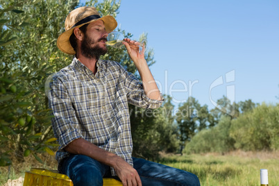 Smiling man having a glass of wine