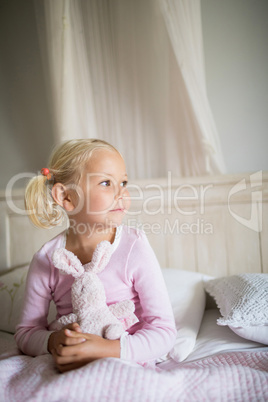 Girl relaxing on bed in the bedroom at home