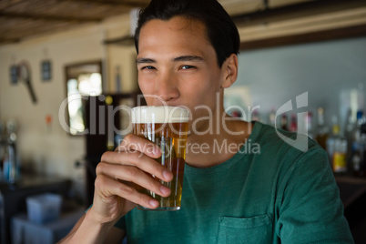 Portrait of man drinking beer