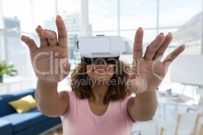 Female executive using virtual reality headset