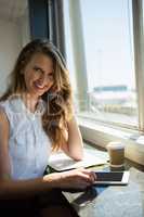 Portrait of smiling businesswoman talking on mobile phone