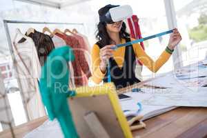 Female designer using virtual reality headset