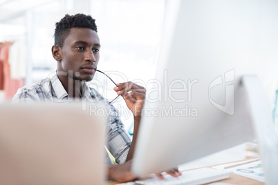 Executive working on computer in office