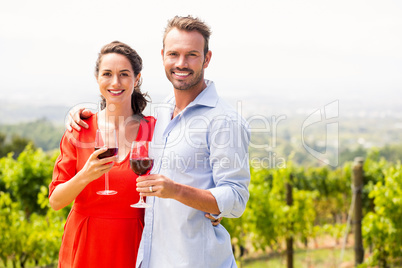 Portrait of happy couple holding wineglasses