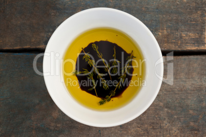 Overhead view of herbs in olive oil
