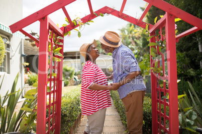 Side view of couple talking in yard