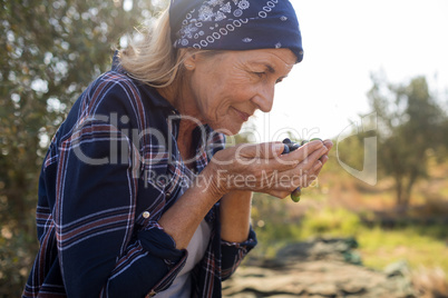 Woman smelling fresh olives