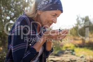 Woman smelling fresh olives