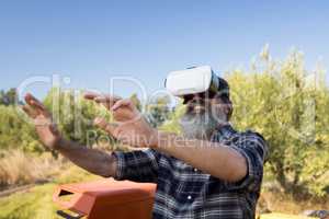 Happy man using virtual reality headset in tractor