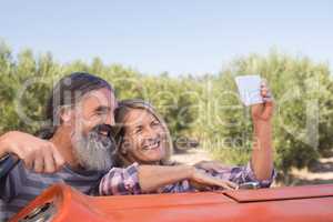 Happy couple taking selfie from mobile