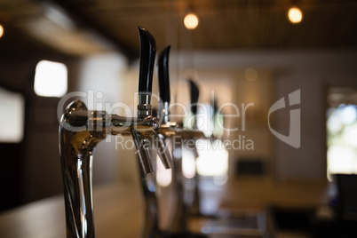 Close-up of beer pump at counter