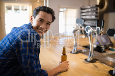 Man having beer at counter