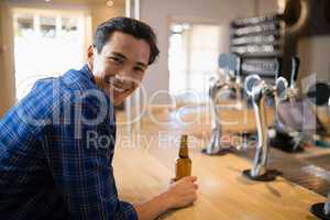 Man having beer at counter