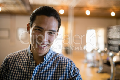 Smiling man at counter in restaurant Smiling man at counter in restaurant
