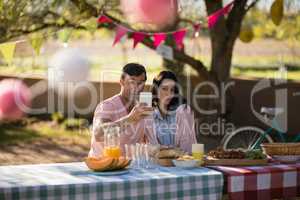 Couple taking selfie on mobile phone