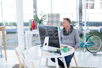 Male executive sitting at desk in the office