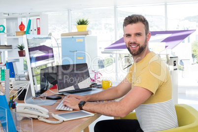 Male executive working on computer at desk