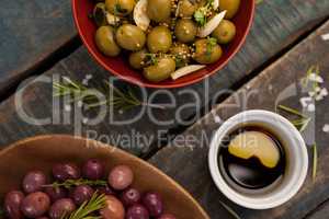Close up of olives with drink on table