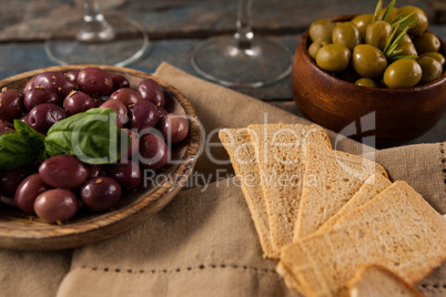 Black and green olives served with crackers