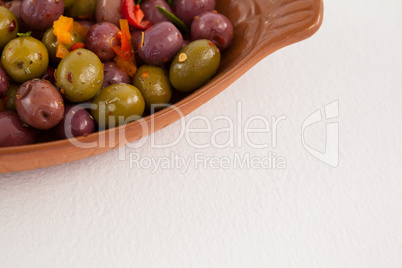 Cropped image of olives served in container