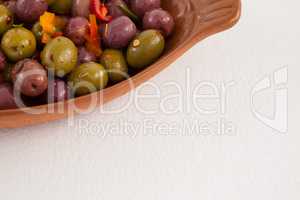 Cropped image of olives served in container