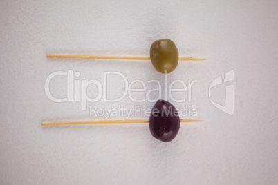 Overhead view of olives in toothpick