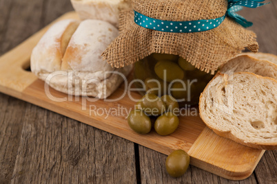 Close up of olives by bread