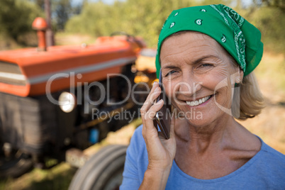 Portrait of happy woman talking on mobile phone