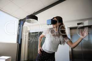Businesswoman gesturing while using virtual reality simulator