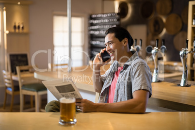 Man talking on mobile phone in a restaurant