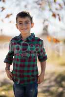 Smiling boy standing in park