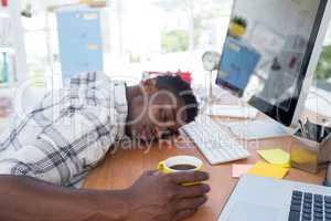 Male executive resting at his desk