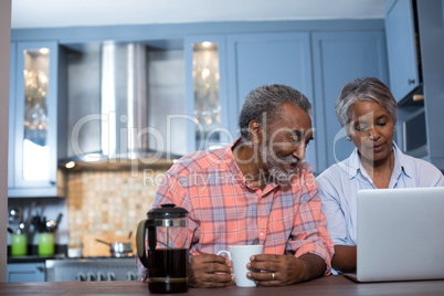 Couple looking at laptop