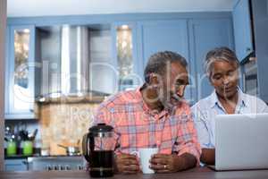 Couple looking at laptop