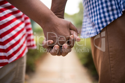 Cropped image of senior couple holding hands