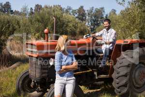 Couple interacting in olive farm