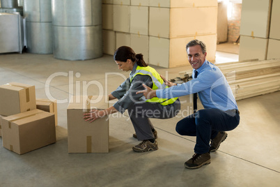 Manager motivating female worker while working