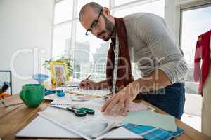 Male designer drawing sketch in workshop