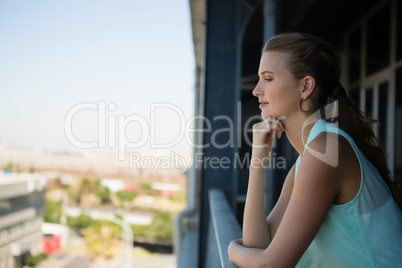 Woman standing in office balcony